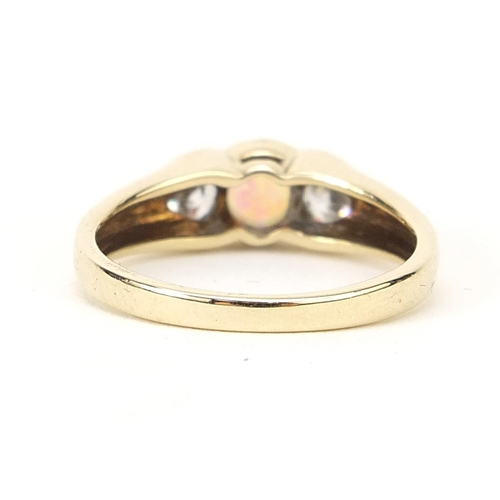 155 - 9ct gold cabochon opal and clear stone ring, size M, 2.7g