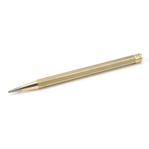 10 - Unmarked gold propelling pencil with engine turned body, 11cm in length, 15.5g