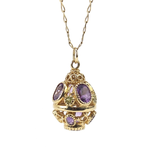 154 - 9ct gold amethyst and peridot ball pendant on a 9ct gold necklace, 2.8cm high and 56cm in length, 9.... 