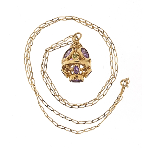 154 - 9ct gold amethyst and peridot ball pendant on a 9ct gold necklace, 2.8cm high and 56cm in length, 9.... 