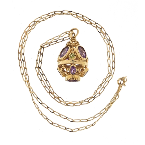 154 - 9ct gold amethyst and peridot ball pendant on a 9ct gold necklace, 2.8cm high and 56cm in length, 9.... 