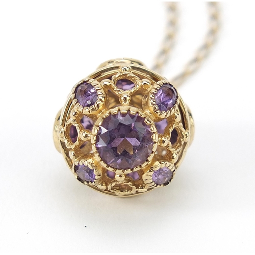 154 - 9ct gold amethyst and peridot ball pendant on a 9ct gold necklace, 2.8cm high and 56cm in length, 9.... 