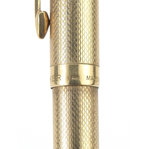 8 - Parker, 9ct gold cased Biro pen with engine turned body, 12.8cm in length, 18.5g