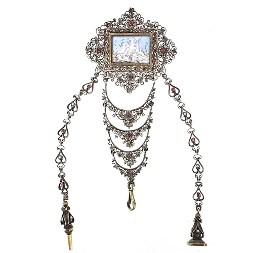 156 - Antique unmarked white metal ruby and multi gem chatelaine with watch key, fob and panel enamelled w... 