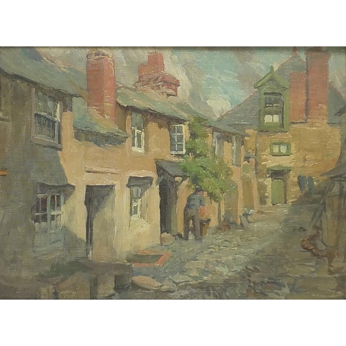 557 - Village street scene with cottages and figure, 20th century oil on canvas board, indistinctly signed... 