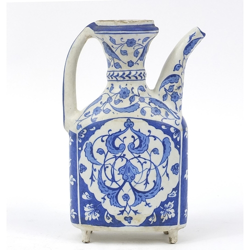 217 - Turkish Iznik pottery water jug hand painted with flowers, 24.5cm high