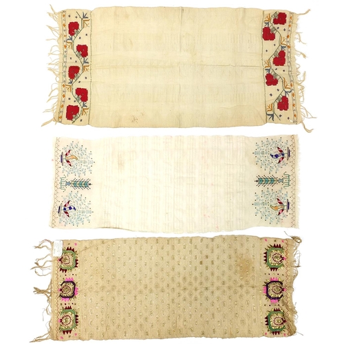 454 - Three antique South Serbian ceremonial towels embroidered with flowers, the largest each 110cm x 40c... 