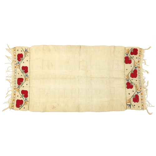 454 - Three antique South Serbian ceremonial towels embroidered with flowers, the largest each 110cm x 40c... 