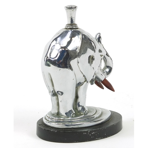 106 - Ronson, Art Deco chrome table lighter in the form of an elephant raised on an oval art metalworks ba... 