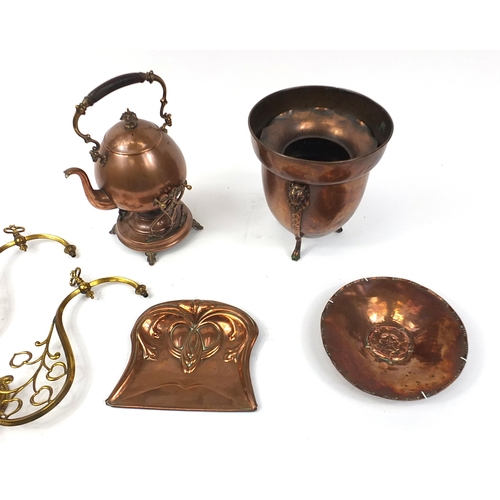 1704 - Decorative arts metalware including a copper teapot on stand with burner, copper dish embossed with ... 