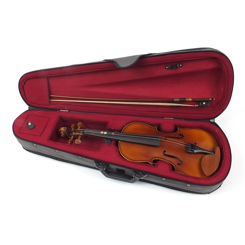 1728 - Child's violin with bow and case with Sandner paper label, the back 32cm in length