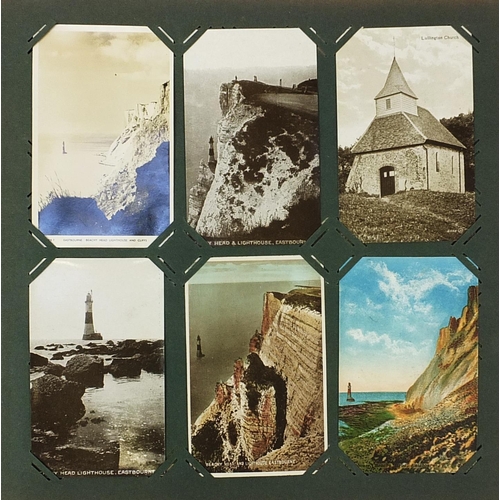 1217 - Local Eastbourne postcards arranged in an album including Beachy Head and Carpet Gardens