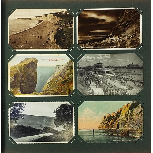 1217 - Local Eastbourne postcards arranged in an album including Beachy Head and Carpet Gardens