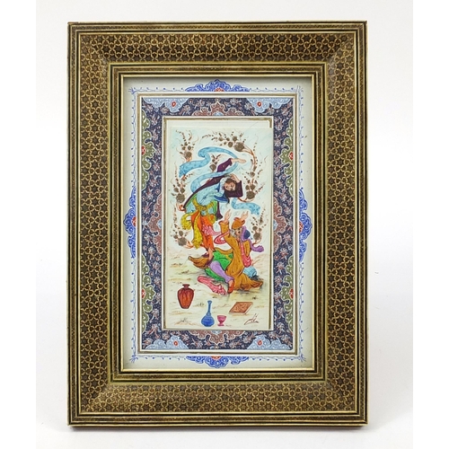 275 - Persian rectangular panel hand painted with two figures housed in a Vizagapatam style frame, overall... 