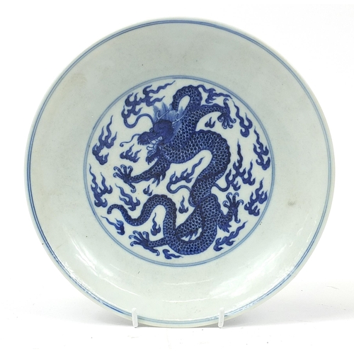 448 - Chinese blue and white porcelain shallow dish hand painted with dragons amongst clouds, six figure c... 