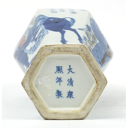 296 - Chinese blue and white with iron red porcelain hexagonal vase hand painted with an Emperor on horseb... 