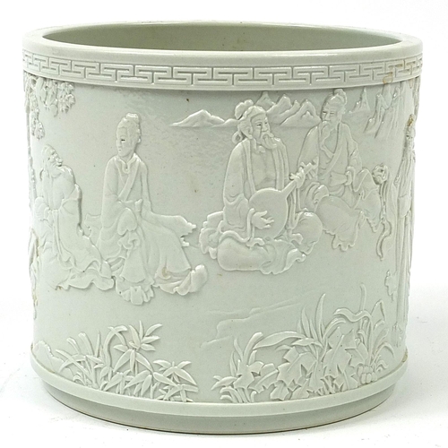 532 - Chinese porcelain blanc de chine brush pot decorated in relief with an Emperor and figures in a pala... 