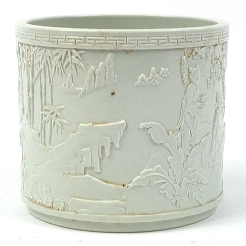 532 - Chinese porcelain blanc de chine brush pot decorated in relief with an Emperor and figures in a pala... 