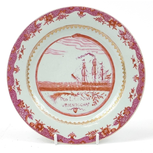 243 - Chinese pink monochrome porcelain plate hand painted with a rigged ship, inscribed Dus Leydons Vrien... 