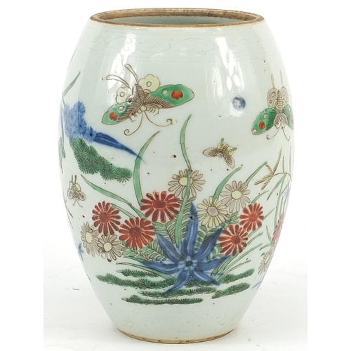 347 - Chinese wucai porcelain vase hand painted with butterflies amongst flowers, 15cm high