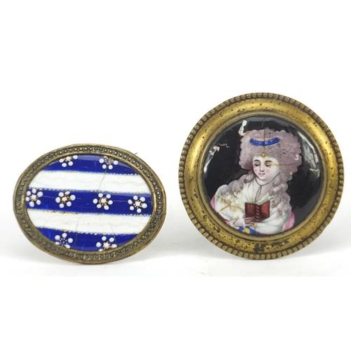 64 - Two Georgian brass handles with enamel panels including one hand painted with a female holding a boo... 