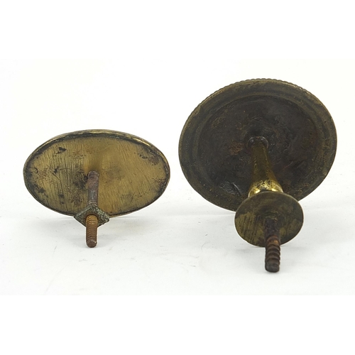 64 - Two Georgian brass handles with enamel panels including one hand painted with a female holding a boo... 