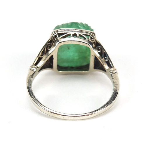 886 - Unmarked white gold carved emerald flower head ring with diamond set shoulders, size Q, 4.7g