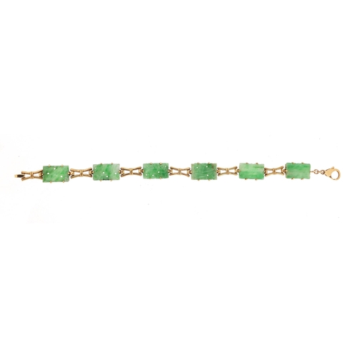 788 - 9ct gold bracelet set with six Chinese carved green jade panels, 20cm in length, 13.6g