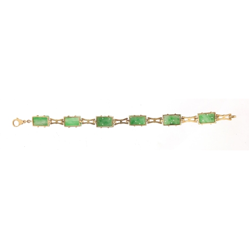 788 - 9ct gold bracelet set with six Chinese carved green jade panels, 20cm in length, 13.6g