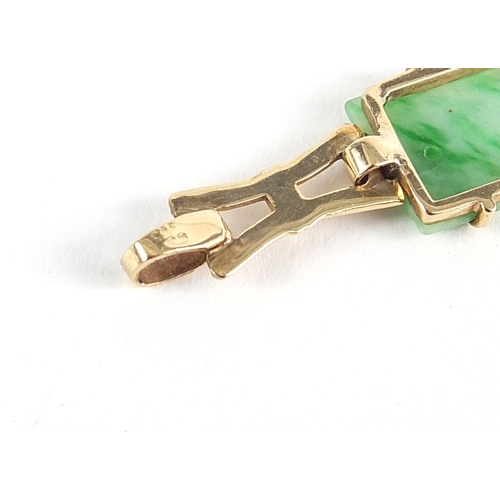 788 - 9ct gold bracelet set with six Chinese carved green jade panels, 20cm in length, 13.6g