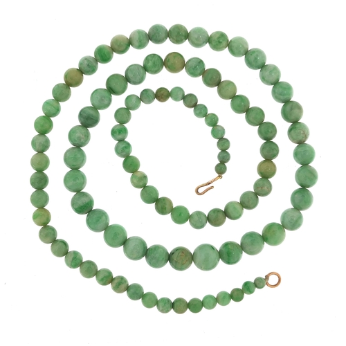 1160 - Chinese graduated green jade bead necklace with gold coloured metal clasp, the largest bead 1cm in d... 