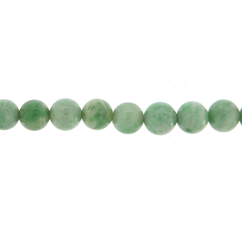 1160 - Chinese graduated green jade bead necklace with gold coloured metal clasp, the largest bead 1cm in d... 