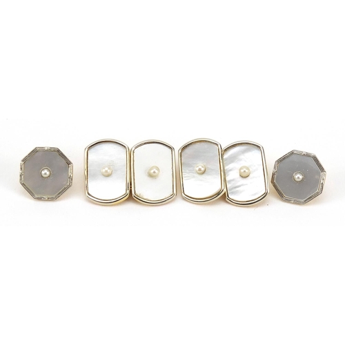 1106 - 18ct gold and 9ct gold gentlemen's mother of pearl cufflinks and dress studs, housed in a fitted box... 