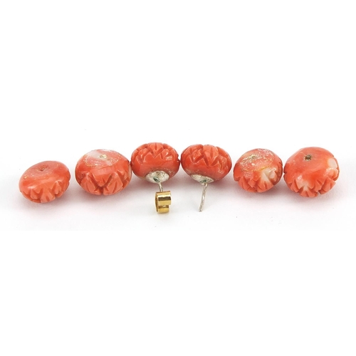 1139 - Three pairs of carved pink coral beads including a pair of earrings, the largest 1.2cm in diameter, ... 