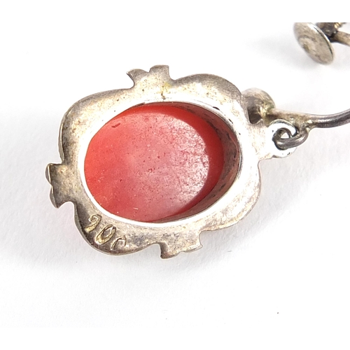 1084 - Silver cabochon coral and marcasite jewellery suite comprising necklace, earrings and ring, housed i... 