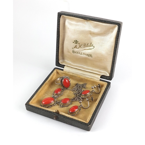 1084 - Silver cabochon coral and marcasite jewellery suite comprising necklace, earrings and ring, housed i... 