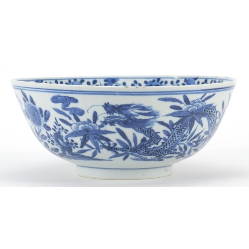 344 - Chinese blue and white porcelain bowl hand painted with a dragon amongst flowers, four figure charac... 