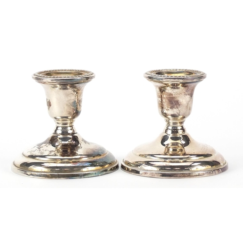 74 - Birks, pair of circular sterling silver dwarf candlesticks, 8cm high, 576.2g