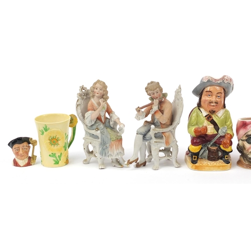 1703 - Collectable china including a Carltonware cup numbered 1395, musical Toby jug, pair of bisque figure... 