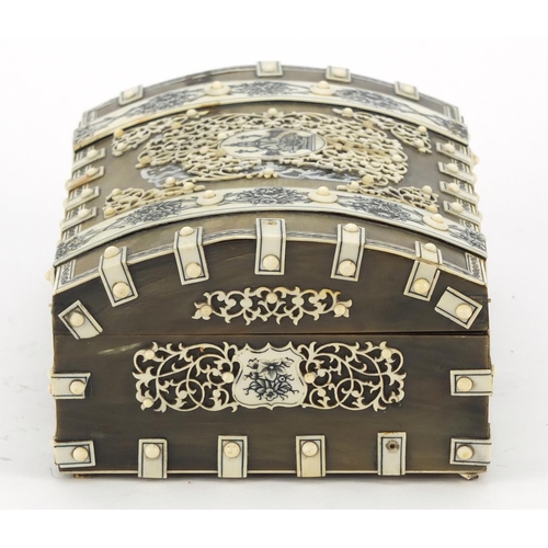 457 - Anglo Indian horn, sandalwood and ivory dome topped casket on paw feet, the ivory penwork panels dec... 