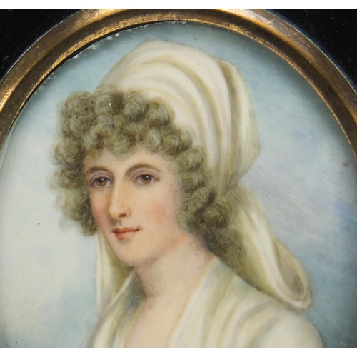 255 - 19th Century oval hand painted portrait miniature of a young female, housed in an ebonised frame, in... 