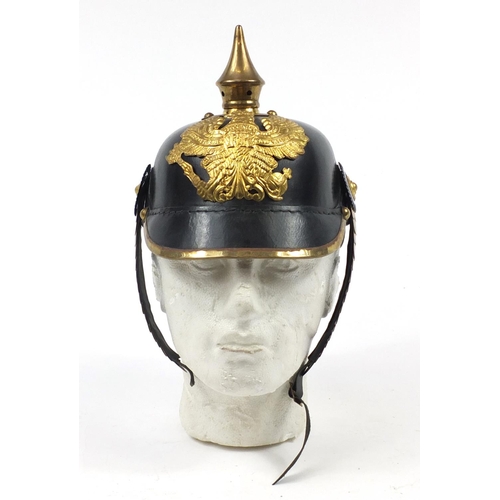 610 - German military interest Pickelhaube with brass chin strap and leather liner