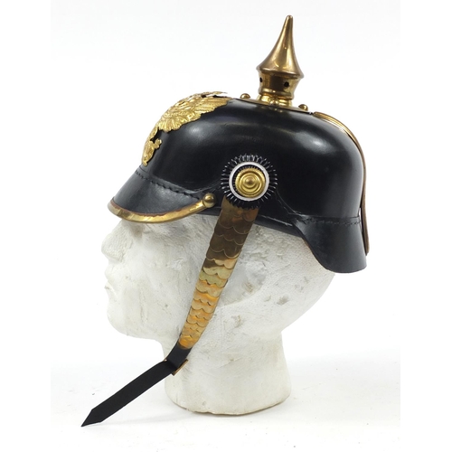 610 - German military interest Pickelhaube with brass chin strap and leather liner