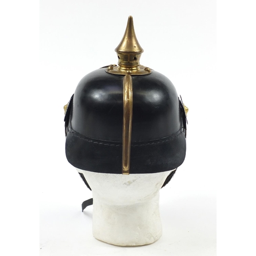 610 - German military interest Pickelhaube with brass chin strap and leather liner