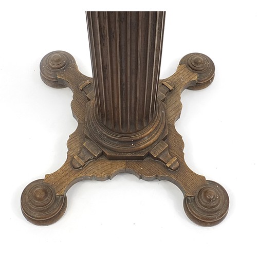 684 - Oak lectern with turned column, 146cm high PROVENANCE: Boris Johnson's school, Ashdown Preparatory