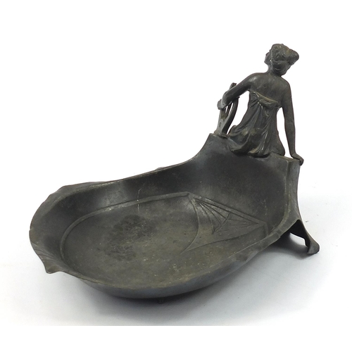 417 - WMF, German Art Nouveau pewter dish surmounted with a female holding an instrument, numbered 289, 25... 