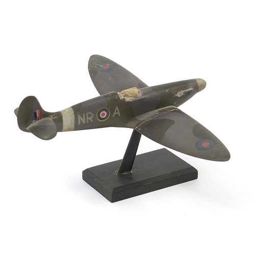 608 - Military interest hand painted wooden model of a Spitfire, inscribed made by Flight Lieutenant Ralph... 