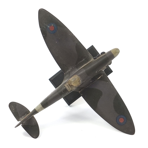 608 - Military interest hand painted wooden model of a Spitfire, inscribed made by Flight Lieutenant Ralph... 