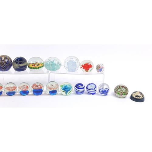 1537 - Collection of colourful glass and celluloid paperweights including Mdina, the largest approximately ... 