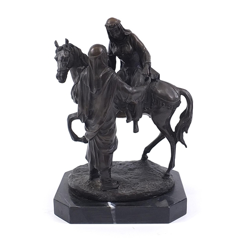 59 - Large patinated bronze study of a Arab gentleman attending a lady, raised on a black marble base, 44... 
